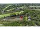Expansive aerial view showcasing the neighborhood's lush landscape and proximity to the golf course at 811 Treeloft Trce, Seabrook Island, SC 29455