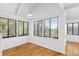 Bright dining area with large windows offering scenic views and hardwood floors at 811 Treeloft Trce, Seabrook Island, SC 29455