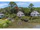 Charming coastal home with a spacious deck overlooking a tranquil pond surrounded by lush greenery at 811 Treeloft Trce, Seabrook Island, SC 29455