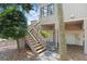 Close up of beach home staircase with underneath parking and storage and beautiful landscaping at 811 Treeloft Trce, Seabrook Island, SC 29455