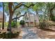 Attractive coastal home with a private driveway, set amidst mature trees and lush landscaping at 811 Treeloft Trce, Seabrook Island, SC 29455