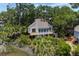 Charming elevated beach house nestled among lush tropical foliage and mature trees at 811 Treeloft Trce, Seabrook Island, SC 29455