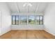 Bright room with hardwood floors, featuring windows overlooking a scenic green landscape at 811 Treeloft Trce, Seabrook Island, SC 29455