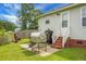 View of the backyard featuring a grill, small staircase, and grassy area at 8692 Bentwood Dr, North Charleston, SC 29406