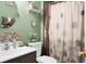 Bathroom with vanity sink, toilet and a shower with decorative curtain at 8692 Bentwood Dr, North Charleston, SC 29406