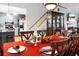 This dining room opens into the kitchen and features a red tablecloth at 8692 Bentwood Dr, North Charleston, SC 29406