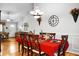 Dining room with hardwood floors and an open concept floor plan into the living room at 8692 Bentwood Dr, North Charleston, SC 29406