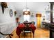 This dining room features a large table with a red tablecloth and decorative accents at 8692 Bentwood Dr, North Charleston, SC 29406