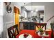 The dining room with hardwood floors opens into the kitchen at 8692 Bentwood Dr, North Charleston, SC 29406
