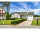 Inviting single-Gathering home with a green lawn, a driveway leading to an attached garage at 8692 Bentwood Dr, North Charleston, SC 29406