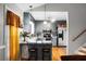 Bright kitchen features stainless steel appliances, updated cabinetry, and bar seating area at 8692 Bentwood Dr, North Charleston, SC 29406