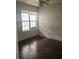 A well-lit bedroom features hardwood floors and a ceiling fan at 8930 Selah St, North Charleston, SC 29406