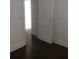 Bedroom with hardwood floors and a white door at 8930 Selah St, North Charleston, SC 29406