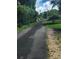A tree lined paved street in a suburban neighborhood at 8930 Selah St, North Charleston, SC 29406