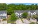 Aerial view of a residential area showcasing well-maintained homes surrounded by lush greenery and mature trees at 9049 Parlor Dr, Ladson, SC 29456