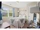 Cozy bedroom with natural light, complemented by tasteful décor and calming colors at 9049 Parlor Dr, Ladson, SC 29456