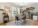 Charming dining area with a decorative chandelier, light-filled window, and stylish decor at 9049 Parlor Dr, Ladson, SC 29456