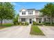 Inviting two-story home with a covered front porch, tidy landscaping, and a welcoming entrance at 9049 Parlor Dr, Ladson, SC 29456