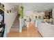 Inviting foyer featuring hardwood floors, a staircase, and an open view to the living spaces at 9049 Parlor Dr, Ladson, SC 29456