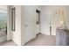Hallway with linen closet, laundry closet and a glimpse into an adjacent bathroom at 9049 Parlor Dr, Ladson, SC 29456