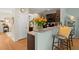 Open kitchen area with granite counters, an island, and stylish bar stool seating at 9049 Parlor Dr, Ladson, SC 29456
