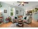 Comfortable living room featuring a sectional sofa, a round coffee table and natural light at 9049 Parlor Dr, Ladson, SC 29456