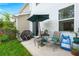 Cozy patio with an umbrella and chairs, perfect for relaxing outdoors at 9049 Parlor Dr, Ladson, SC 29456
