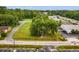 A bird's-eye view of the commercial property with mature trees and a view of the neighborhood beyond at 9612 Hoot Owl Ave, Ladson, SC 29456
