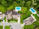 Aerial view of the neighborhood with a pool, manicured lawns, and beautiful landscaping at 9713 Cutleaf Dr, Ladson, SC 29456