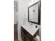 Bathroom featuring a vanity, mirror, and neutral color scheme with a view to the hallway at 9713 Cutleaf Dr, Ladson, SC 29456