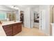 En-suite bathroom with double vanity, walk-in closet, stand-up shower, and access to the bedroom at 9713 Cutleaf Dr, Ladson, SC 29456