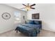 Bedroom with a large bed, a side table with a lamp, and a large window with blinds at 9713 Cutleaf Dr, Ladson, SC 29456