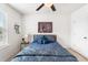 Bedroom with a ceiling fan, a large bed, and a large window with blinds at 9713 Cutleaf Dr, Ladson, SC 29456