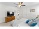 Bedroom with a television on a dresser, a door, a window, and a ceiling fan at 9713 Cutleaf Dr, Ladson, SC 29456