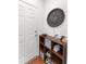 Functional entryway with a shoe rack, storage bins, and a decorative 'The Reids' sign at 9713 Cutleaf Dr, Ladson, SC 29456