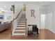 Inviting entryway features wood stairs, bench, decor, and hardwood floors, leading to the living area at 9713 Cutleaf Dr, Ladson, SC 29456