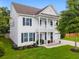 Charming two-story home features a welcoming front porch and well-manicured lawn at 9713 Cutleaf Dr, Ladson, SC 29456