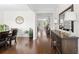 Open foyer with hardwood floors, stylish decor, and a view to other rooms at 9713 Cutleaf Dr, Ladson, SC 29456
