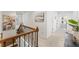 Hallway with staircase, artwork on the walls, and access to other rooms in the house at 9713 Cutleaf Dr, Ladson, SC 29456