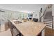 Open-concept kitchen with granite countertops, stainless appliances, and seamless flow to living spaces at 9713 Cutleaf Dr, Ladson, SC 29456