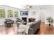 Cozy living room featuring a fireplace, hardwood floors, and comfortable seating at 9713 Cutleaf Dr, Ladson, SC 29456