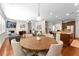 Inviting living room with hardwood floors, a fireplace, comfortable seating, and an open layout to the kitchen at 9713 Cutleaf Dr, Ladson, SC 29456