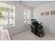 Bright room features massage chair, neutral walls, carpet, and windows offering a neighborhood view at 9713 Cutleaf Dr, Ladson, SC 29456