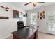 Bright home office with a desk, natural light, and outdoor access at 9713 Cutleaf Dr, Ladson, SC 29456