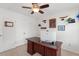 Spacious home office with a large desk, neutral walls, and carpet flooring at 9713 Cutleaf Dr, Ladson, SC 29456