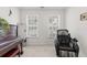 Well-lit piano room with massage chair, windows, and carpet at 9713 Cutleaf Dr, Ladson, SC 29456