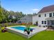 Backyard pool boasts a modern deck and landscaped surroundings, perfect for outdoor enjoyment at 9713 Cutleaf Dr, Ladson, SC 29456