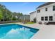 Inviting backyard pool features lounge chairs and outdoor seating for relaxing and entertaining at 9713 Cutleaf Dr, Ladson, SC 29456