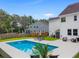 Sparkling pool complemented by a patio and outdoor seating, creating an ideal backyard retreat at 9713 Cutleaf Dr, Ladson, SC 29456