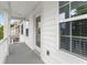 Charming front porch with white trim and natural light at 9713 Cutleaf Dr, Ladson, SC 29456